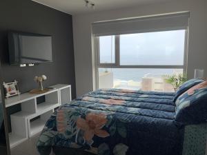 Voodi või voodid majutusasutuse Tantum Concon Apartment toas