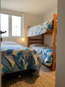 Voodi või voodid majutusasutuse Tantum Concon Apartment toas