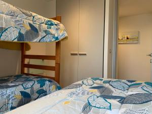 Voodi või voodid majutusasutuse Tantum Concon Apartment toas