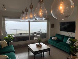 Posezení v ubytování Tantum Concon Apartment