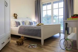 Ένα ή περισσότερα κρεβάτια σε δωμάτιο στο Ferienhaus, Fuhlendorf