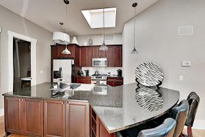 a kitchen with a large island with a counter top at The Lofts at Church St in Asheville
