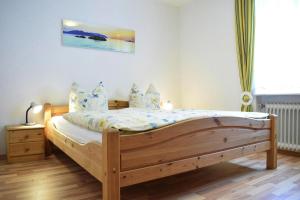a bedroom with a wooden bed in a room at Apartment in Haidmühle in a beautiful area in Haidmühle