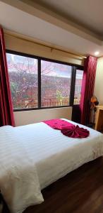 Postel nebo postele na pokoji v ubytování Dang Khoa Garden Inn Homestay