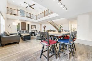 a dining room and living room with a table and chairs at Westwing Retreat in Peoria