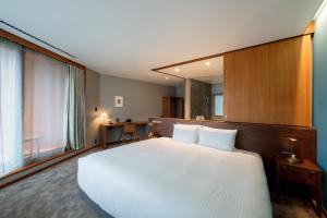 HOTEL AO KAMAKURA客房内的一张或多张床位