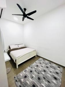 Ένα ή περισσότερα κρεβάτια σε δωμάτιο στο Deena Suite at Troika ,Kota Bharu