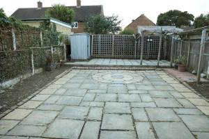 a patio with a gate and a fence at Entire 3 bedroom, 2 baths, 2 toilets, sleeps 10 in Welling
