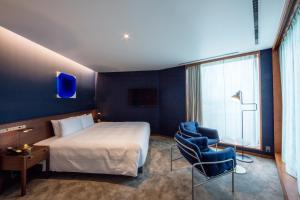 HOTEL AO KAMAKURA客房内的一张或多张床位