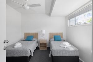 מיטה או מיטות בחדר ב-Seaside Holiday Resort