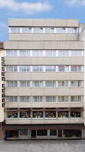 a large building with a lot of windows at Hotel Royal in Munich