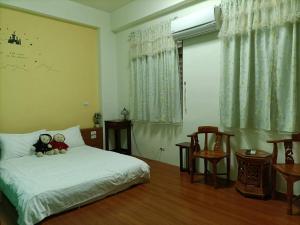 小城堡民宿Little Castle hotel 19窩窩近東大門夜市好停車房間的床