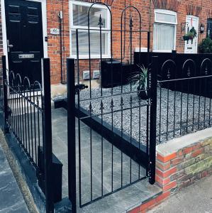 a black fence in front of a house at Modern Single room for rental in Colchester Town Centre! in Colchester