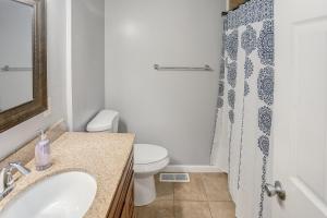 a bathroom with a sink and a toilet and a shower at Belleville Beauty - Luxury Stay for Work or stay for Play either way this is the perfect property for you! residence in Belleville +11 photos