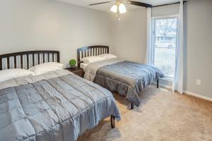 two beds in a room with a window at Belleville Beauty - Luxury Stay for Work or stay for Play either way this is the perfect property for you! residence in Belleville