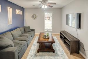 a living room with a couch and a table at Belleville Beauty - Luxury Stay for Work or stay for Play either way this is the perfect property for you! residence in Belleville