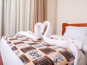 Postel nebo postele na pokoji v ubytování Pori City Hotel