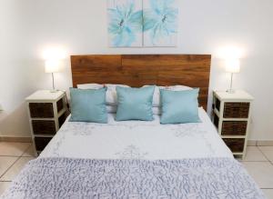 מיטה או מיטות בחדר ב-Green Scape Flatlet