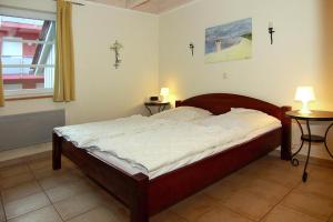 Voodi või voodid majutusasutuse Doppelhaushälfte Ostseehaus I in Trassenheide toas