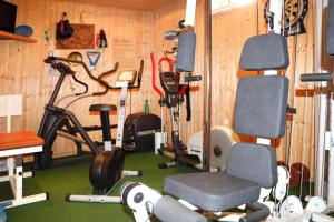 a gym with exercise equipment in a wooden wall at Ferienwohnung, Tambach-Dietharz in Tambach-Dietharz