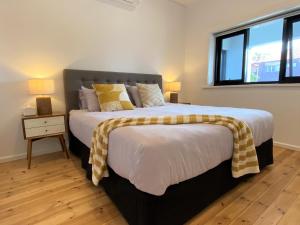 A bed or beds in a room at The Mitchell Bondi Garden 3