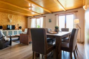 a dining room with a table and chairs at Jewel Duplex in Fieschertal