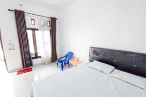Postel nebo postele na pokoji v ubytování Sapu Nyapah Losmen Syariah Tanjung Setia