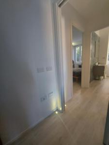 an empty room with a door with a light on it at Domotica Ancona in Ancona