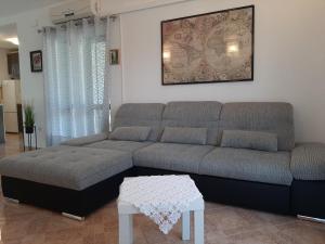 a living room with a couch and a table at Apartment Bruna in Mirce