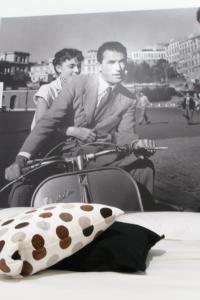 a black and white photo of two men riding motorcycles at 5 Rooms Affittacamere in Civitavecchia