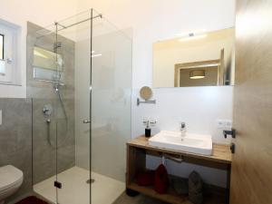 a bathroom with a sink and a shower at Apartment in Milders with Stubai SuperCard in Neustift im Stubaital +28 photos