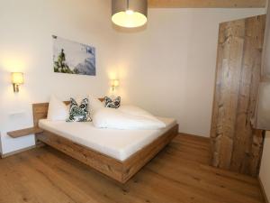 מיטה או מיטות בחדר ב-Apartments Alpenpanorama, Neustift