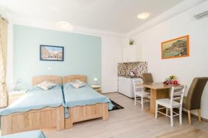 Posteľ alebo postele v izbe v ubytovaní Rooms Tezoro