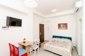 Posteľ alebo postele v izbe v ubytovaní Rooms Tezoro