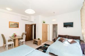 Posteľ alebo postele v izbe v ubytovaní Rooms Tezoro
