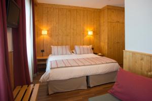 Postel nebo postele na pokoji v ubytování Albergo Ristorante Bucaneve