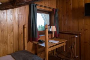 TV a/nebo společenská místnost v ubytování Albergo Ristorante Bucaneve