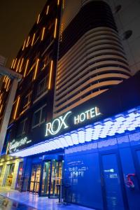 a building with a rolex hotel sign in front of it at ROX Hotel Ankara in Ankara