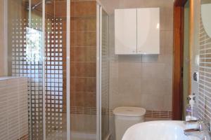 a bathroom with a shower and a toilet and a sink at holiday home, Lukecin in Łukęcin