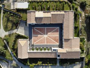 an aerial view of a house with a building at Masseria del Carrubo in Noto