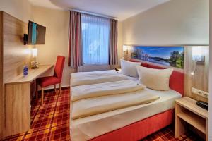 Postelja oz. postelje v sobi nastanitve Hotel Elbparadies