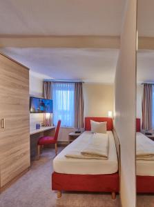 Postelja oz. postelje v sobi nastanitve Hotel Elbparadies