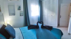 Posteľ alebo postele v izbe v ubytovaní Sage Palm Apartment BY NAMASTE ELITE