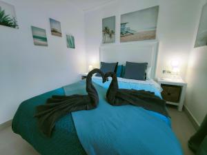 Posteľ alebo postele v izbe v ubytovaní Sage Palm Apartment BY NAMASTE ELITE