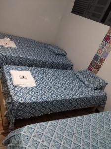 Ліжко або ліжка в номері Pensionato quarto individual em Maringá/pr