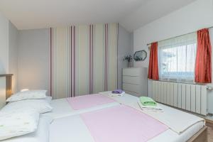 Posteľ alebo postele v izbe v ubytovaní Apartment Teri