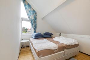 Postel nebo postele na pokoji v ubytování Hello Zeeland - Vakantiehuis Zwin 112