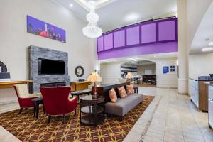 a living room with a couch and a fireplace at La Quinta by Wyndham Garland Harbor Point in Garland