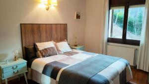Ένα ή περισσότερα κρεβάτια σε δωμάτιο στο Apartament turistic Pont d’Ordino