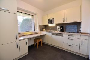 Kuchyň nebo kuchyňský kout v ubytování Haus "Luv und Lee" Appartement LUV29